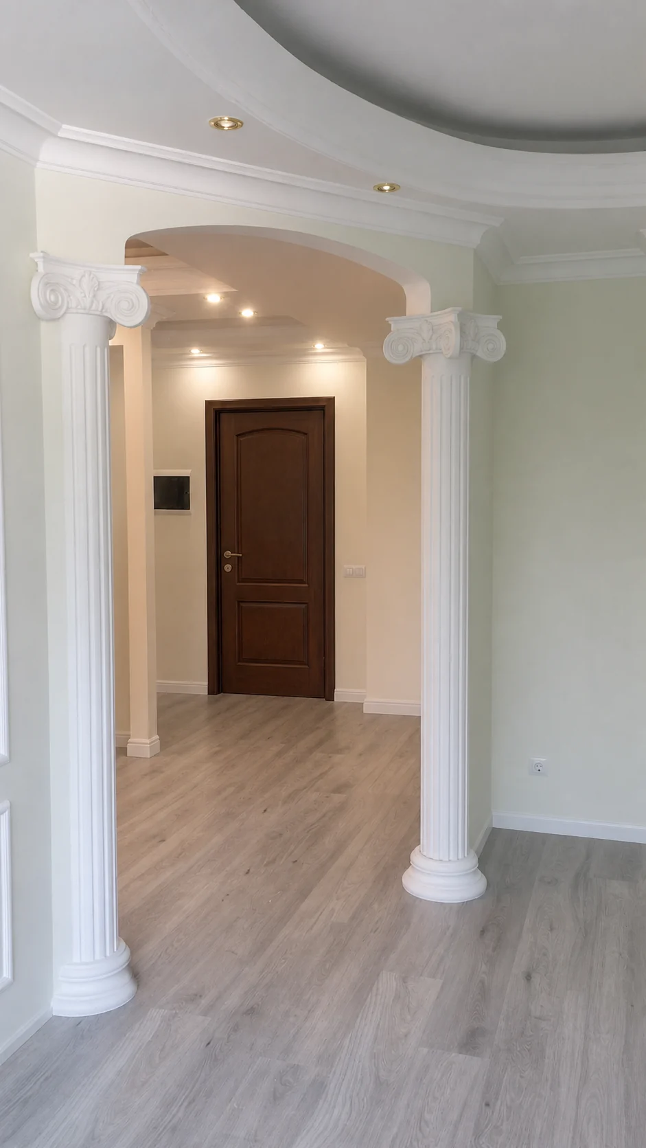 Classical arched opening with decorative white columns