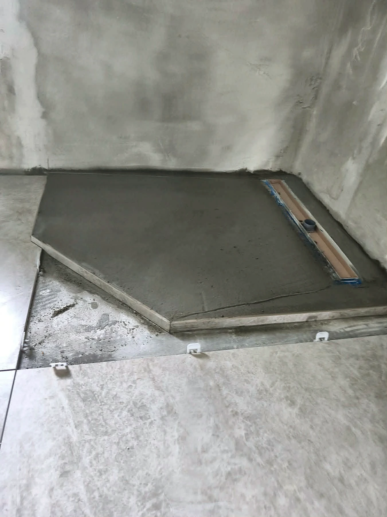 Shower base formed to the required falls