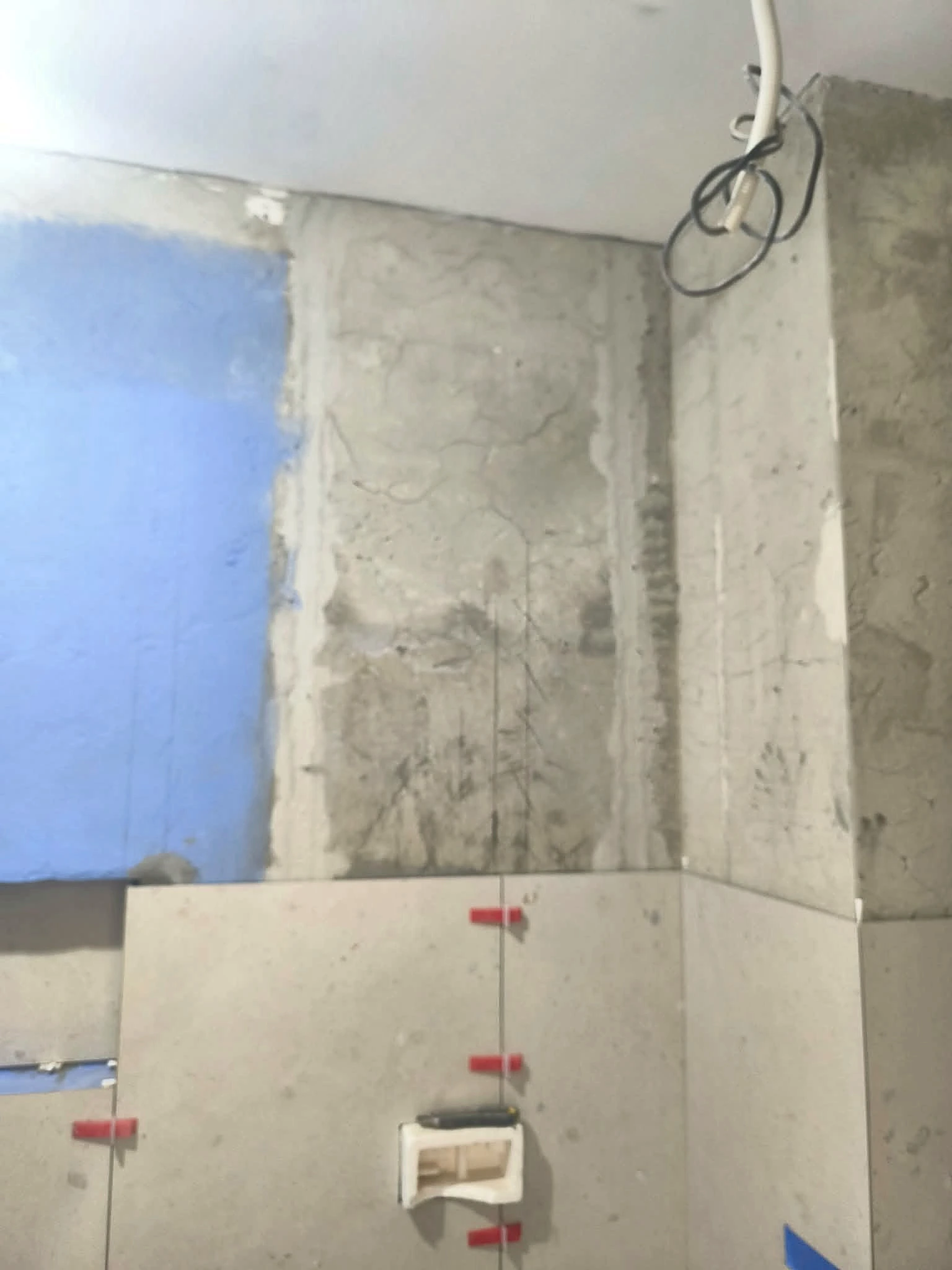Large-format wall tiling in progress