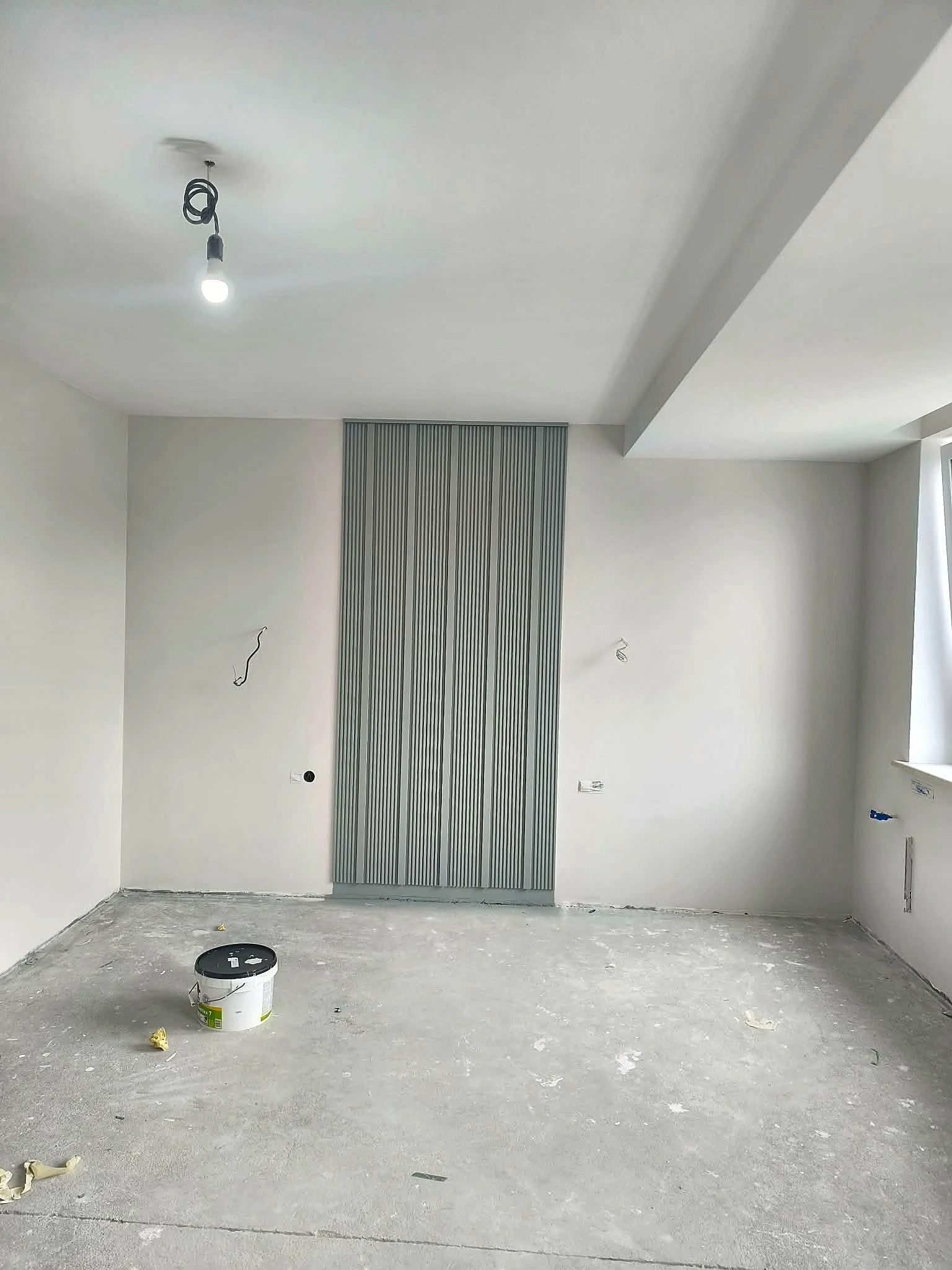 Feature slat panel and wall finishing in progress