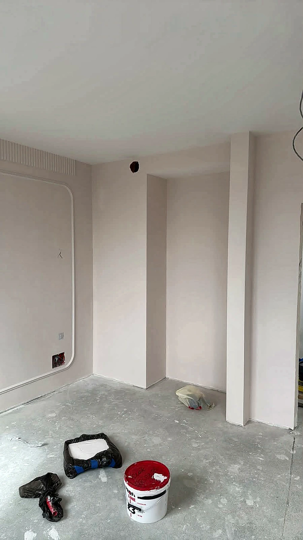 Painting work in progress with protected floors
