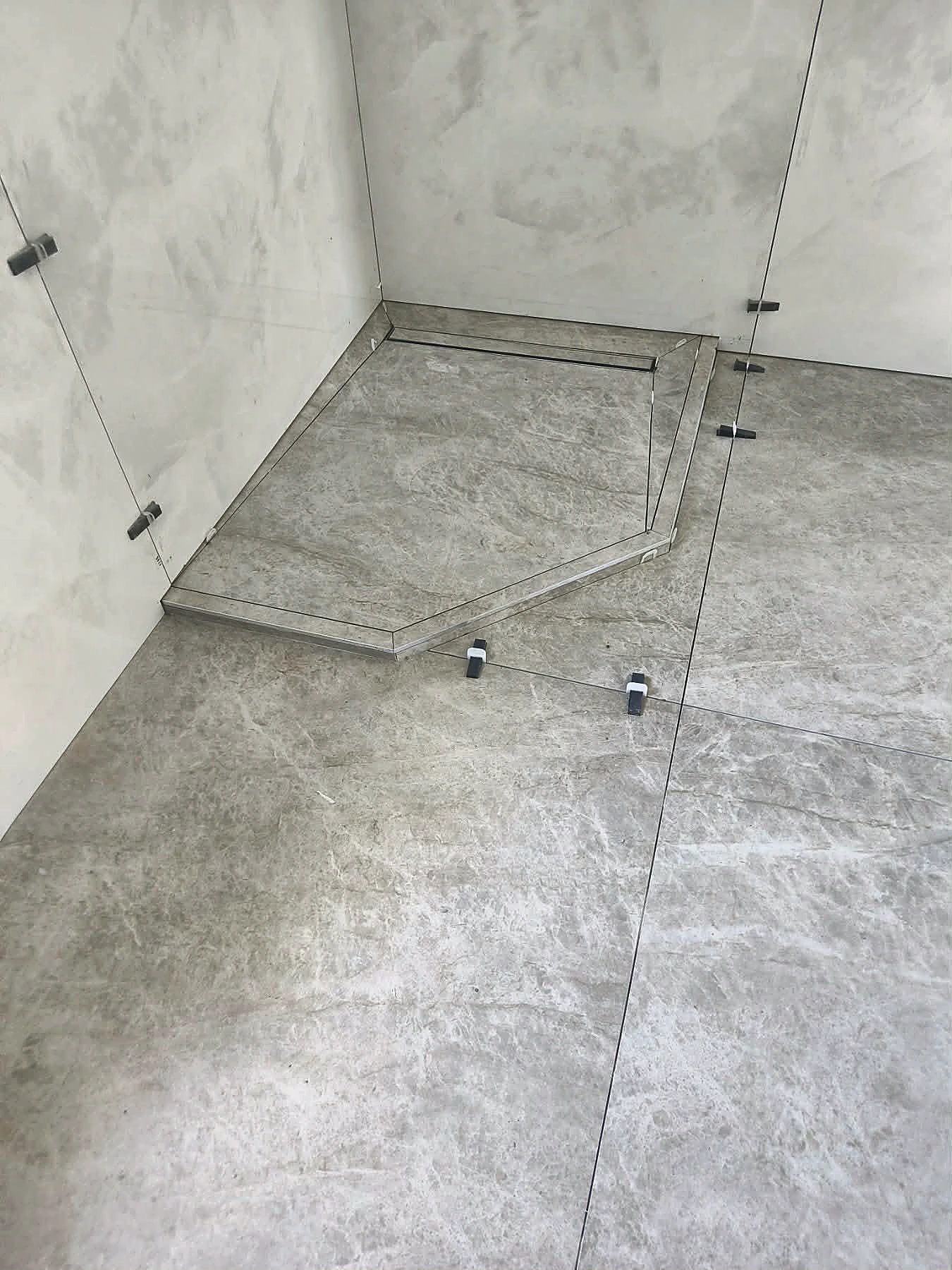 Custom shower tray tiling and drainage detail