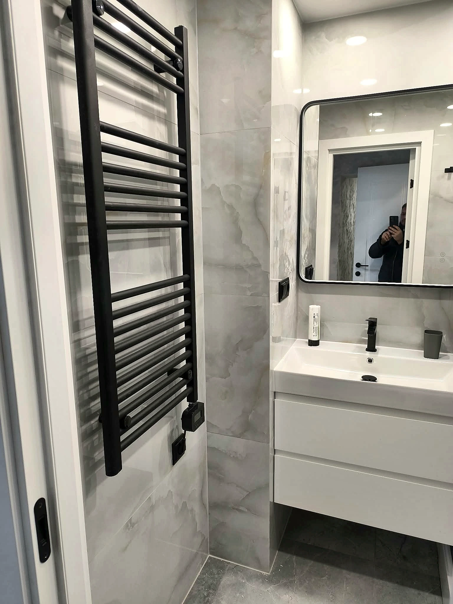 Bathroom vanity area with precise tile alignment